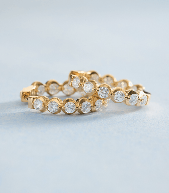 Yellow gold diamond rings with illusion settings. 